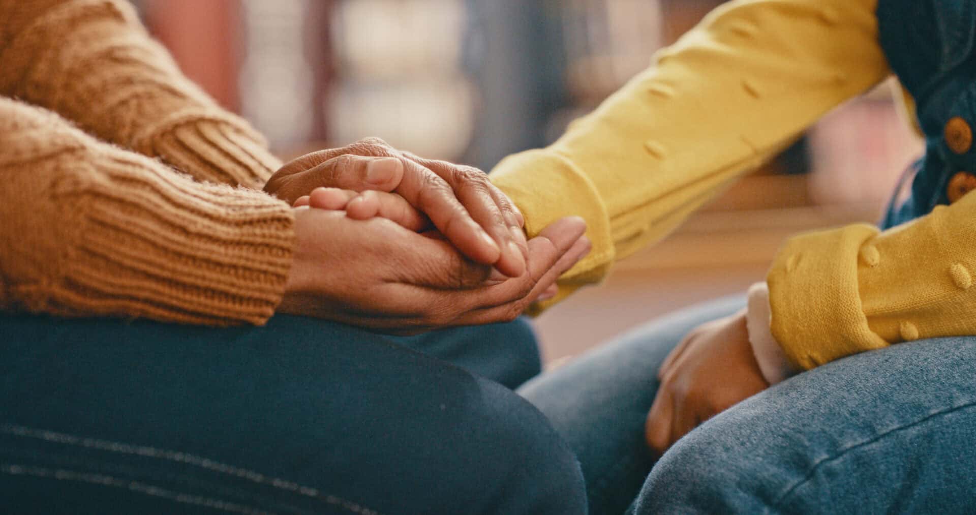 hands, love and care touching in support, trust or unity for community, compassion or understanding. people holding hands in respect for loss, affection or passion for listening, talk or time